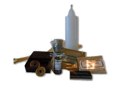 Money spell ritual kit with white candle, gold coin, fenugreek powder, magnetic gold, and Van-Van potion in a 13 by 4 inch box